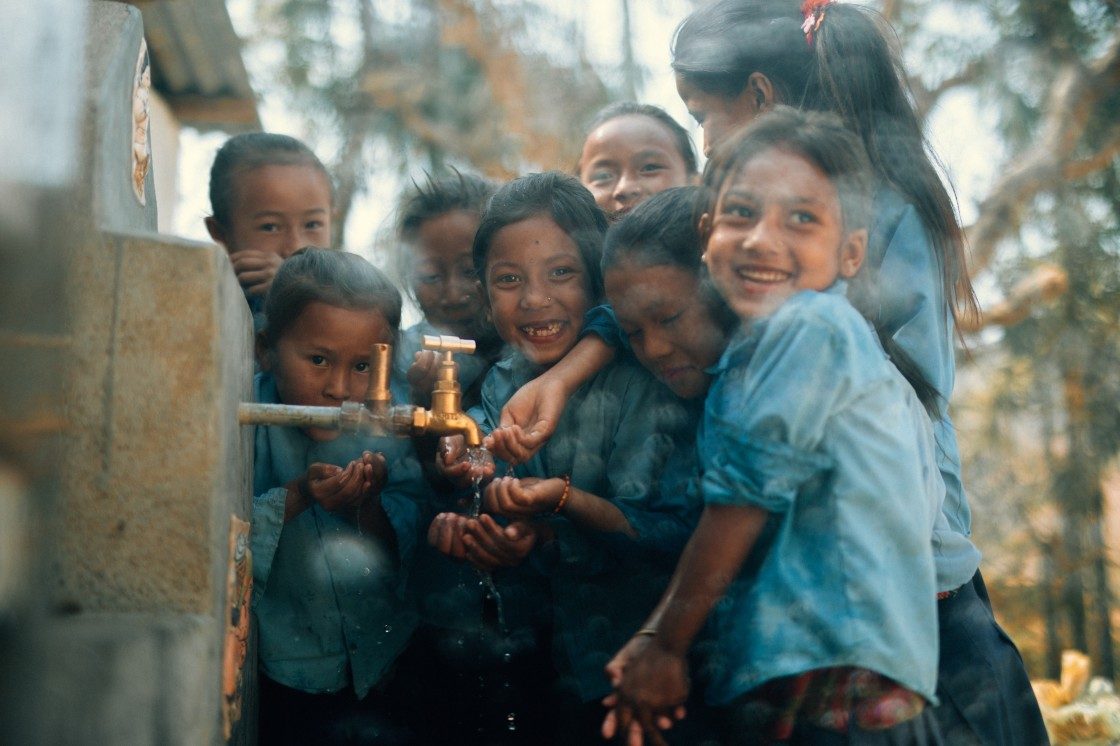 Kids sharing clean tap water